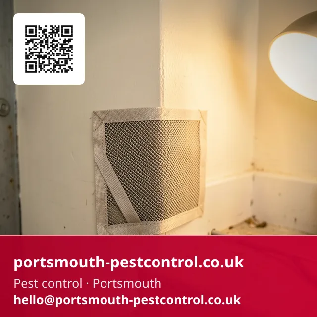 Mesh proofing patch being fitted at a garage floor-to-wall junction