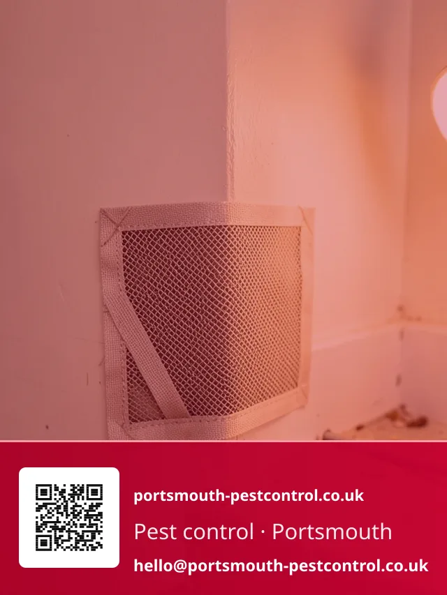 Mesh proofing patch being fitted at a garage floor-to-wall junction