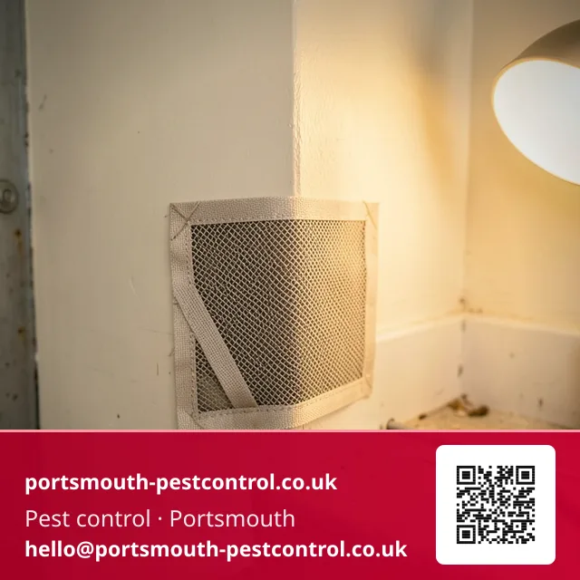 Mesh proofing patch being fitted at a garage floor-to-wall junction