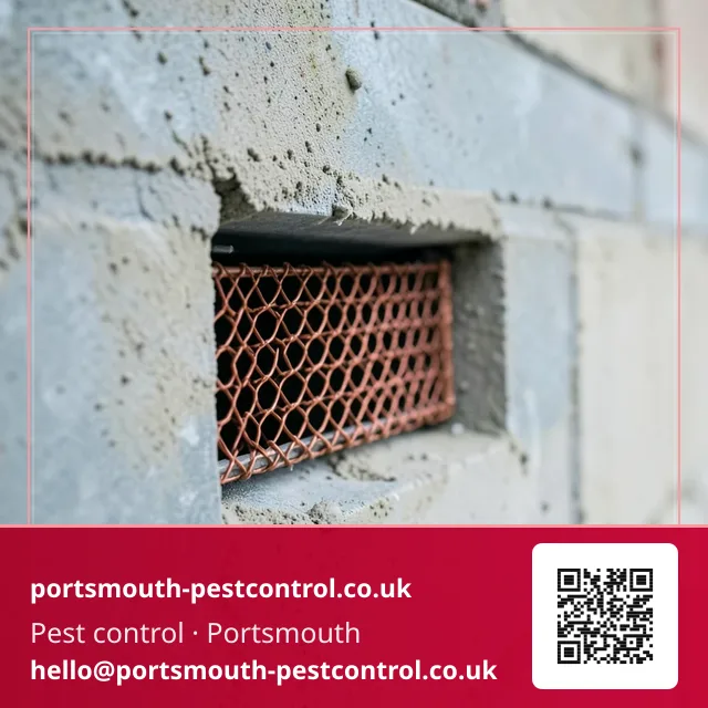 Copper mesh being fitted into a cavity wall weep vent